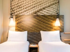Ein Bett oder Betten in einem Zimmer der Unterkunft ibis Paris Saint-Denis Stade Sud