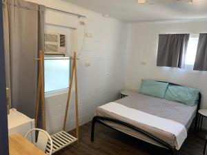 Mumma's Hostel Cairns客房内的一张或多张床位
