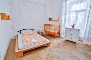 Posteľ alebo postele v izbe v ubytovaní Rodinný hostel Stárkův dům