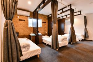 Кровать или кровати в номере Samurai Stay Sugamo-Male Only