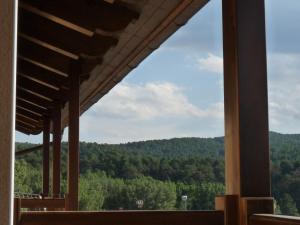 a view of the mountains from the porch of a building at La Casona de Navaleno in Navaleno