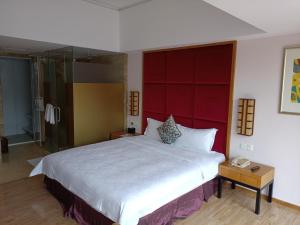 Letto o letti in una camera di Dongguan Well Garden Hotel
