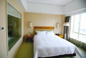 Letto o letti in una camera di Dongguan Well Garden Hotel