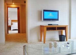 TV o dispositivi per l'intrattenimento presso Dongguan Well Garden Hotel