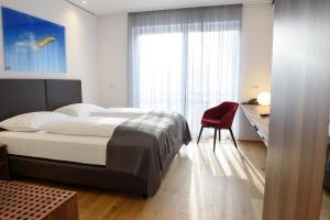 Postel nebo postele na pokoji v ubytování Hotel Wallern Garni + 27 fotografií