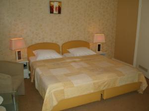 Una cama o camas en una habitación de Hotel Excelsior