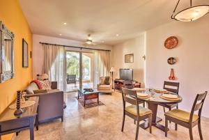 a living room with a table and a dining room at Colorful Paraiso del Mar Resort Condo with Patio! in La Paz