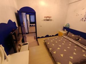 Voodi või voodid majutusasutuse 水里河堤咖啡民宿 Shuili Heti coffee B&B toas