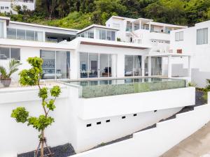 an aerial view of a white house with a swimming pool at Villa Claire - Seaview Private Villa in Bophut