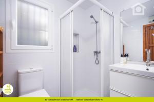 a bathroom with a shower and a toilet and a sink at Solhabitat Coll de Mar in Calpe +47 photos