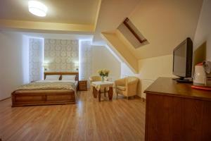 Posteľ alebo postele v izbe v ubytovaní Jawor Pokoje i Apartamenty
