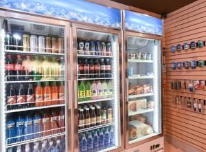 a refrigerator filled with lots of different types of drinks at Holiday Inn Express & Suites - Madisonville, an IHG Hotel in Madisonville