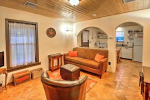 a living room with a couch and a kitchen at Charming Couples Casita, Walk to Old Mesilla Plaza in Las Cruces