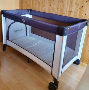 a bunk bed with a blue canopy in a room at Aegerta Alte Schreinerei in Tschiertschen