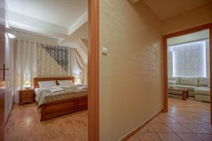 Posteľ alebo postele v izbe v ubytovaní Jawor Pokoje i Apartamenty