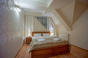 Posteľ alebo postele v izbe v ubytovaní Jawor Pokoje i Apartamenty