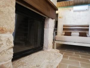Postel nebo postele na pokoji v ubytování Trulli Resort Monte Pasubio Trulli bbalberobellocom