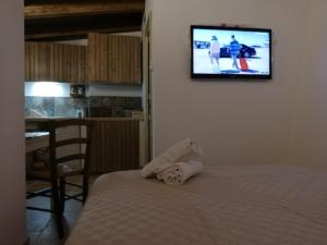 Postel nebo postele na pokoji v ubytování Trulli Resort Monte Pasubio Trulli bbalberobellocom
