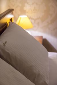 Posteľ alebo postele v izbe v ubytovaní Jawor Pokoje i Apartamenty