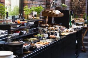 a buffet line with many different types of food at Best Western Hotel Mariacki Katowice in Katowice