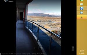 a balcony of a building with a view of a valley at Riverside Hotel in Mām Derai