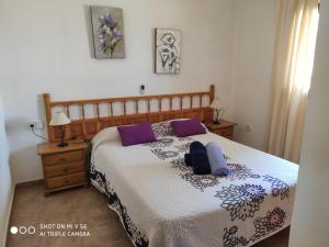 a bedroom with a bed with two pillows on it at MAR Y MONTAÑA FORMENTERA in Sant Francesc Xavier +60 photos