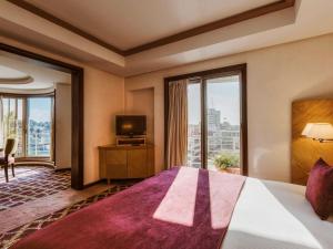 Ένα ή περισσότερα κρεβάτια σε δωμάτιο στο Le Diwan Hotel Rabat - MGallery Collection