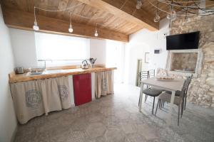 A kitchen or kitchenette at Aria di Vico Aparthotel