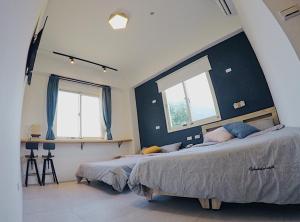 Cama ou camas em um quarto em Go On Vacation Hostel Green Island