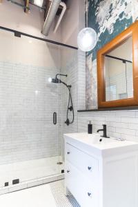 a bathroom with a sink and a shower at 506 Lofts in Nashville