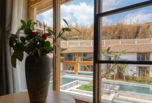 Fotografie z fotogalerie ubytování Yuanyan Heyuan Homestay v destinaci Kchun-ming