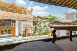 Fotografie z fotogalerie ubytování Yuanyan Heyuan Homestay v destinaci Kchun-ming