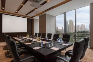 a conference room with a long table and chairs at Crowne Plaza Wuxi Taihu, an IHG Hotel in Wuxi
