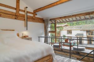 Fotografie z fotogalerie ubytování Yuanyan Heyuan Homestay v destinaci Kchun-ming