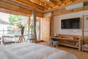 Fotografie z fotogalerie ubytování Yuanyan Heyuan Homestay v destinaci Kchun-ming