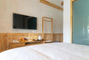 Fotografie z fotogalerie ubytování Yuanyan Heyuan Homestay v destinaci Kchun-ming