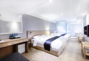 Postel nebo postele na pokoji v ubytování Stay Inn 2