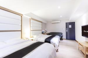 Postel nebo postele na pokoji v ubytování Stay Inn 2