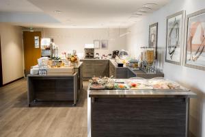 a kitchen filled with furniture and a counter top at Hotel Kauppi in Tampere
