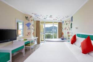 Postel nebo postele na pokoji v ubytování Sunshine Resort Intime Sanya