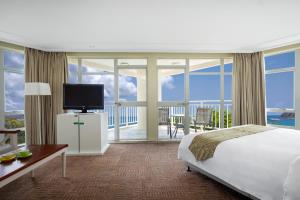 Postel nebo postele na pokoji v ubytování Sunshine Resort Intime Sanya