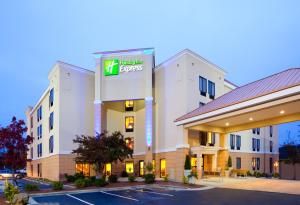 a hotel with a sign on the front of it at Holiday Inn Express Durham, an IHG Hotel in Durham