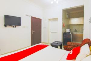 Qumra Furnished Apartments tesisinde bir odada yatak veya yataklar