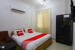 Кровать или кровати в номере Qumra Furnished Apartments