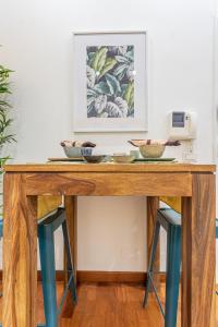 a wooden table with bowls on top of it at Design Suite Trevi Fountain in Rome