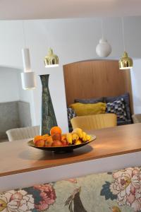 a plate of fruit sitting on a table at Águamel Sintra, Boutique Guest House in Sintra