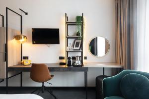 TV in/ali zabaviščno središče v nastanitvi Ariane Hotel