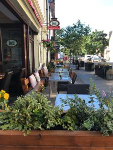 a row of tables and chairs outside a restaurant at No12 Hotel in North Berwick +29 photos