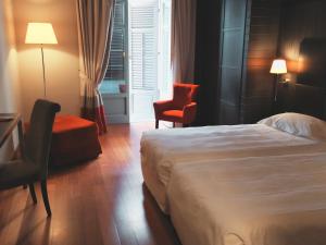 Postel nebo postele na pokoji v ubytování Hotel Porta Felice & Spa