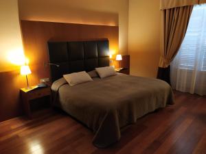 Postel nebo postele na pokoji v ubytování Hotel Porta Felice & Spa